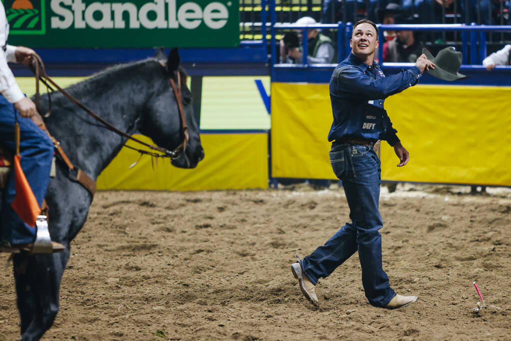 Bridger Anderson gestures to the crowd during the National Finals Rodeo at the Thomas & Mac ...