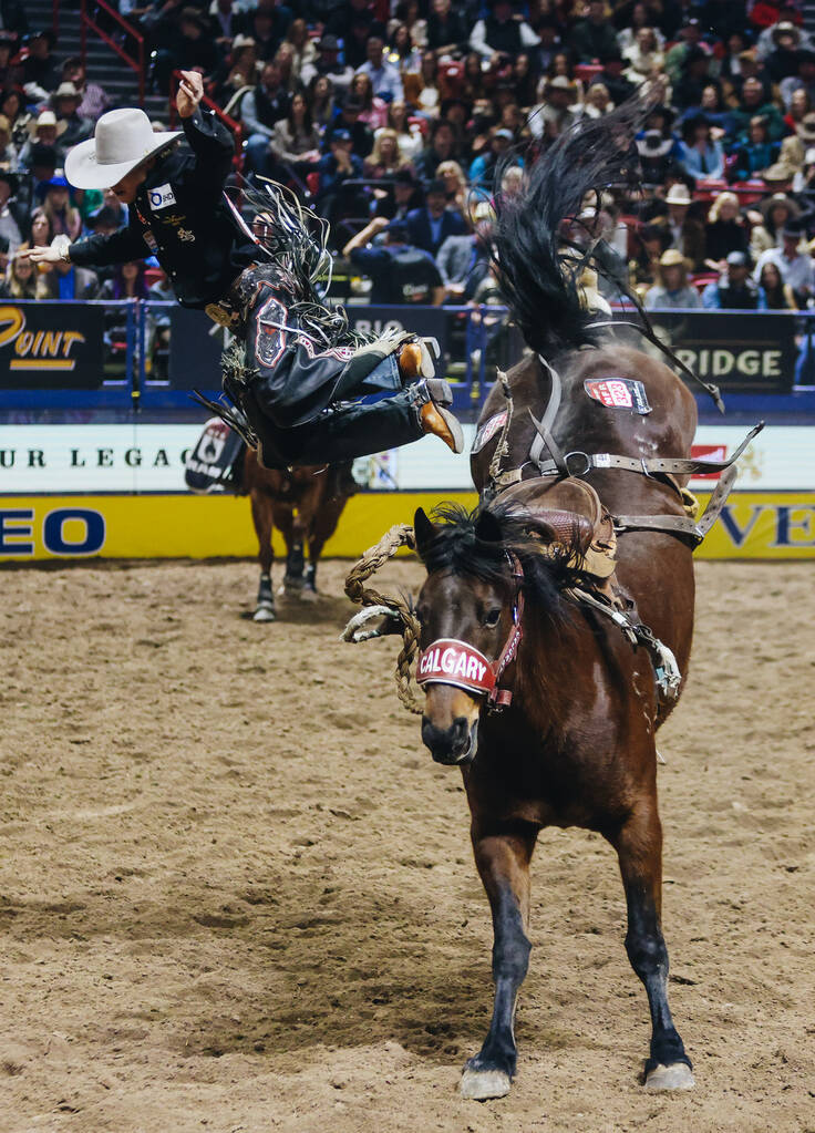 Dawson Hay jumps off of the horse during the National Finals Rodeo at the Thomas & Mack Cen ...