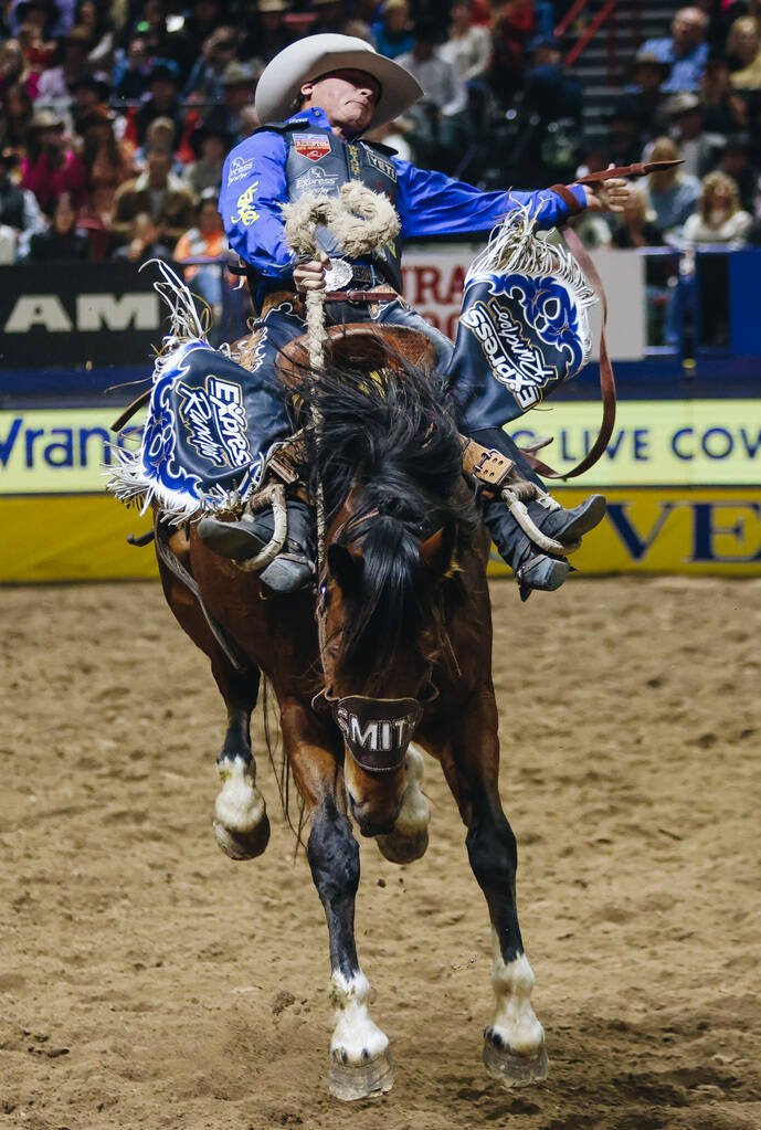 Ryder Wright stays on the horse during the National Finals Rodeo at the Thomas & Mack Cente ...