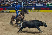 Colter Todd ropes the back legs the calf during the National Finals Rodeo at the Thomas & M ...