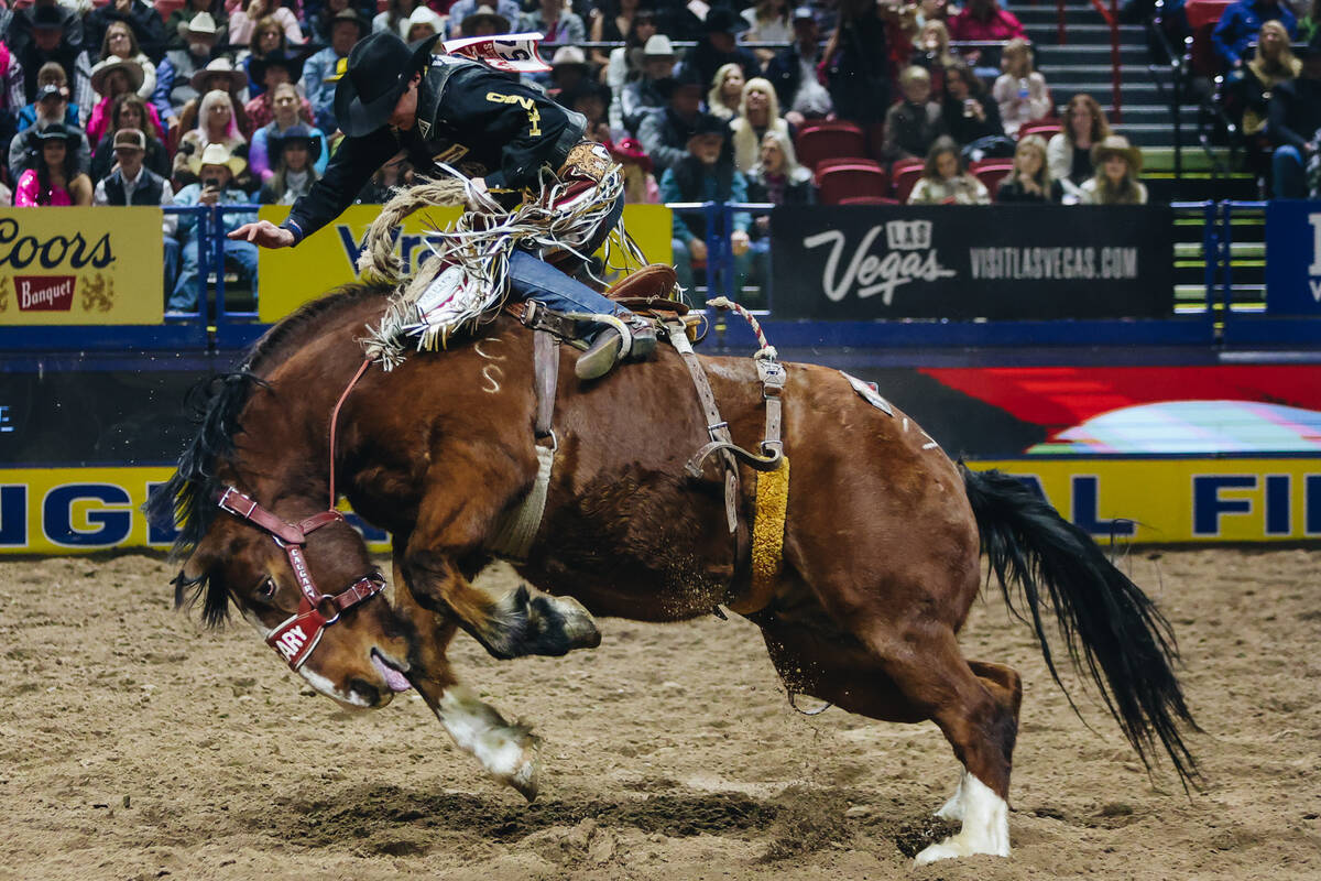 Layton Green rides during the saddle bronc portion of the National Finals Rodeo at the Thomas & ...