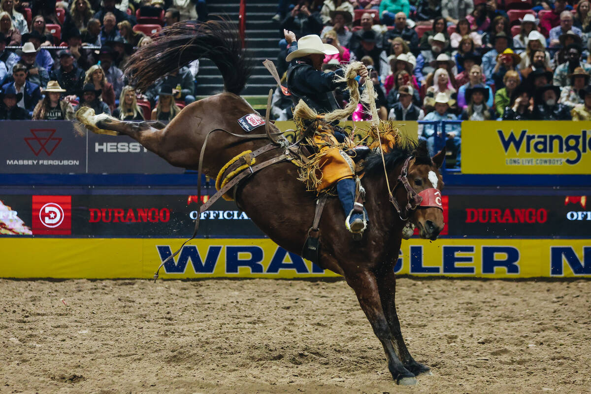 Brody Cress rides during the saddle bronc portion of the National Finals Rodeo at the Thomas &a ...