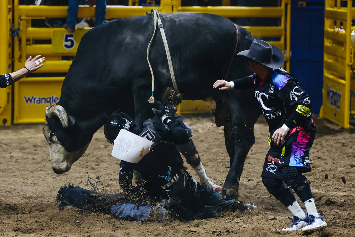 Cody Teel falls off the bull during the National Finals Rodeo at the Thomas & Mack Center o ...