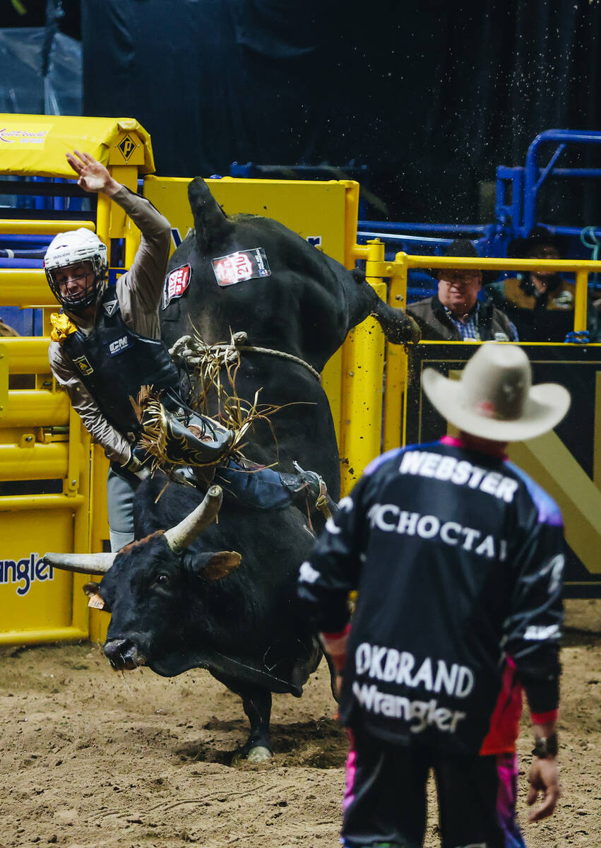 Cullen Telfer rides the bull during the National Finals Rodeo at the Thomas & Mack Center o ...