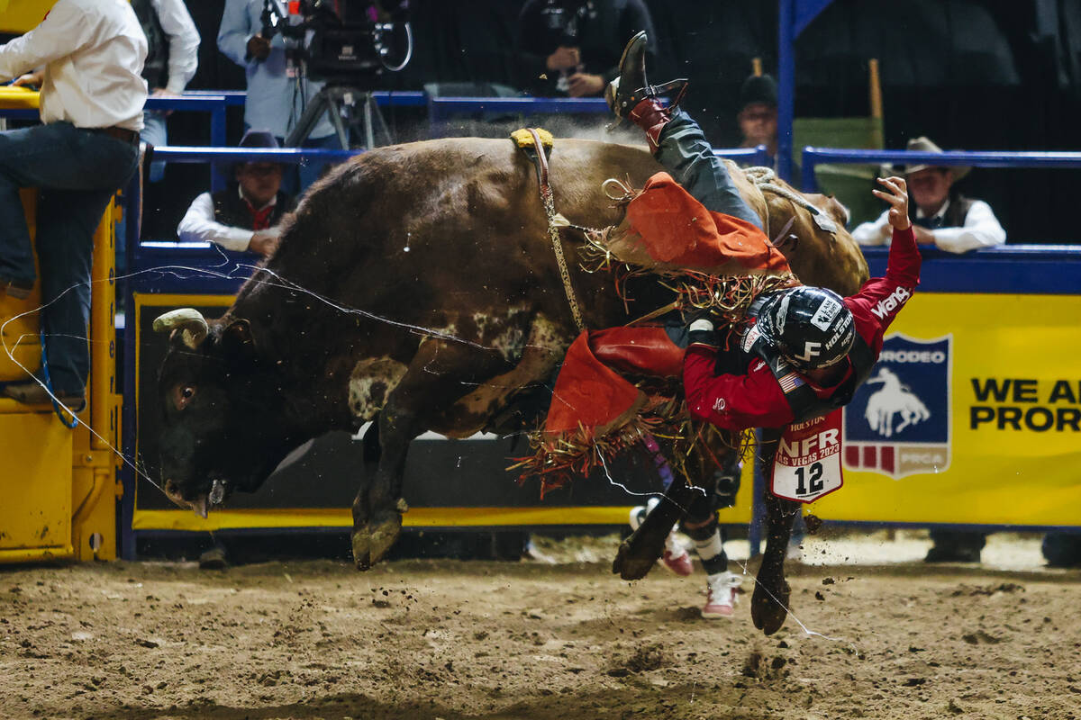 Trey Holston falls off of the bull during the National Finals Rodeo at the Thomas & Mack Ce ...