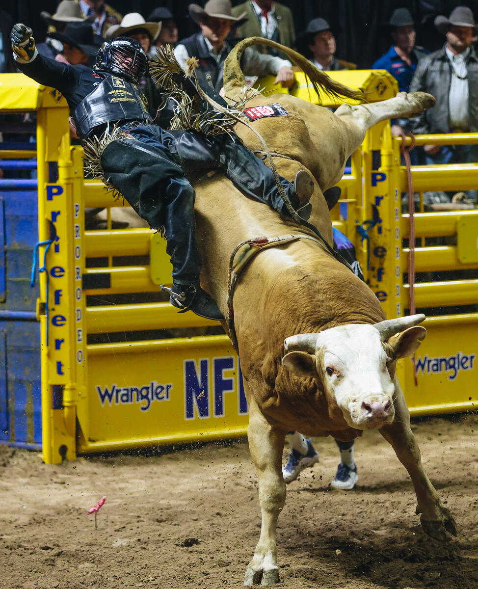 Sage Kimzey falls off of the bull during the National Finals Rodeo at the Thomas & Mack Cen ...
