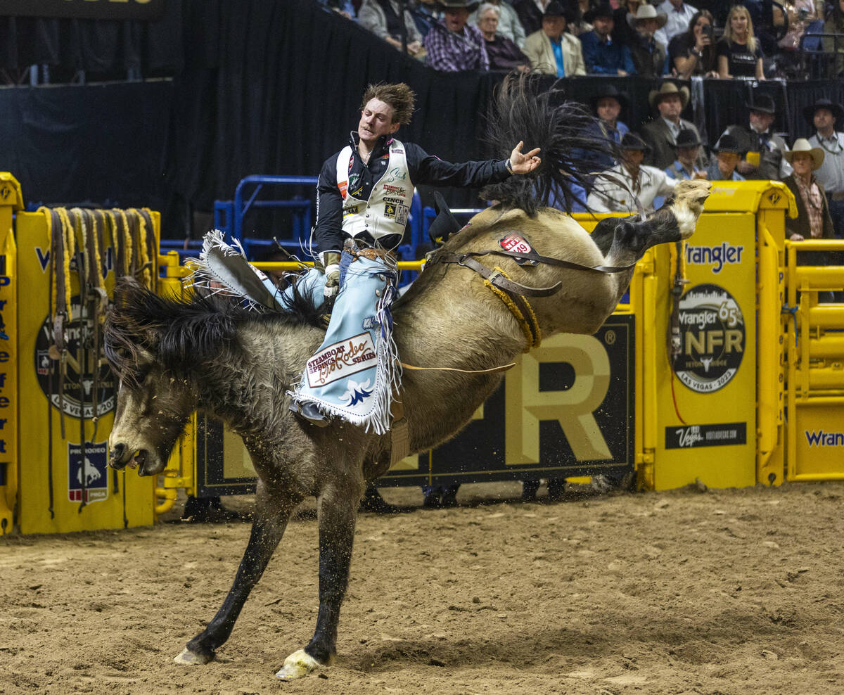 Keenan Hayes rides Straight Ringer in Bareback Riding during the final day action of the NFR at ...