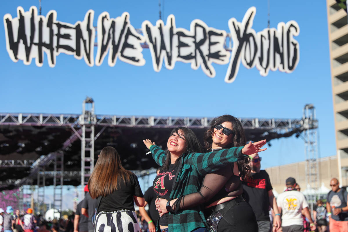 Punk rock fans Alexia Gallegos, right, and Vanessa Pulido hug eachother at the When We Were You ...