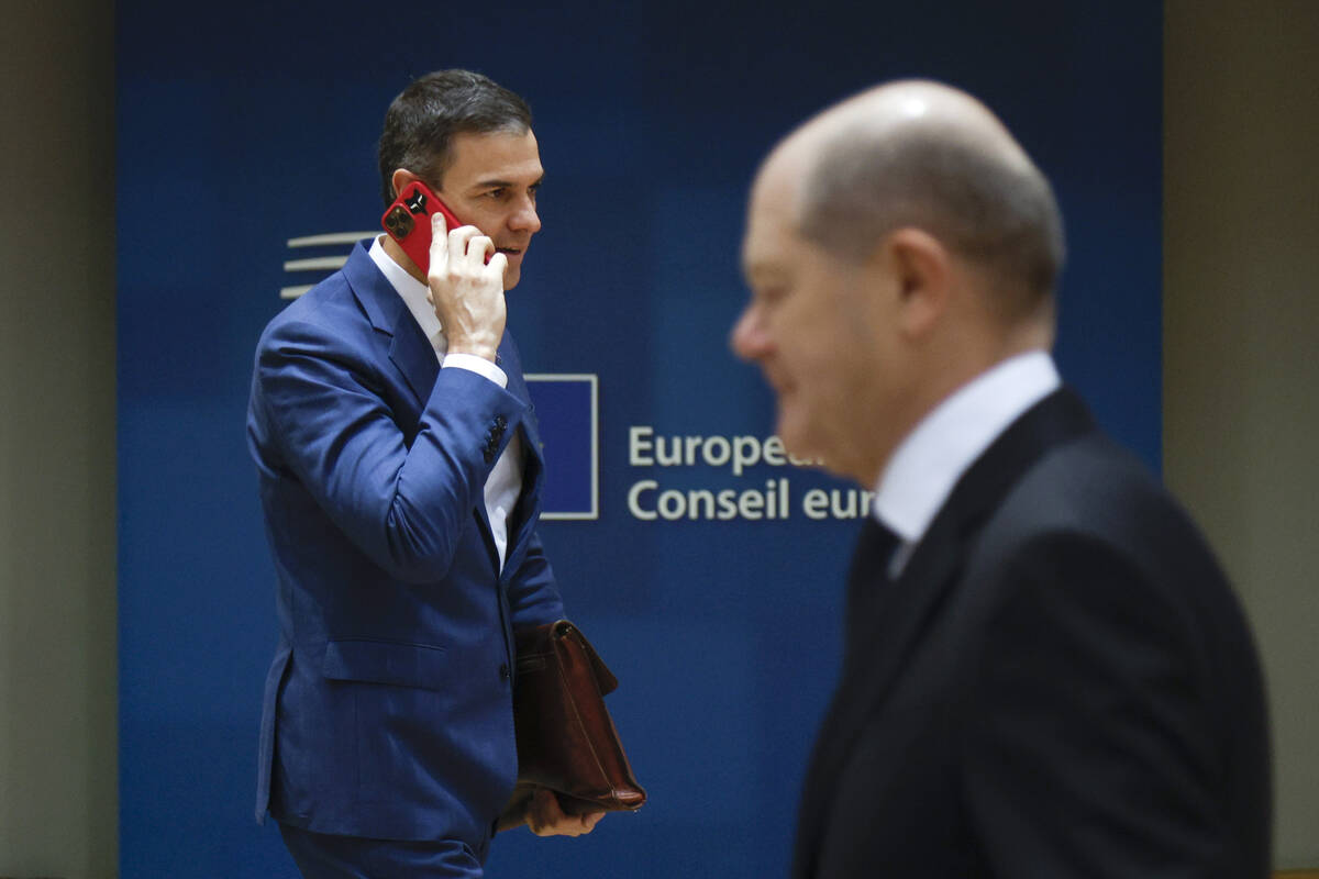 Germany's Chancellor Olaf Scholz, right, and Spain's Prime Minister Pedro Sanchez arrive for a ...