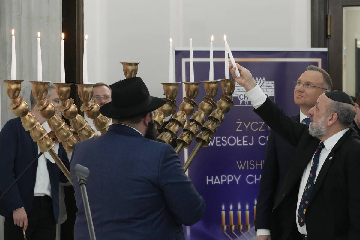 Members of parliament, President Andrzej Duda, second right, and the Polish Jewish community co ...