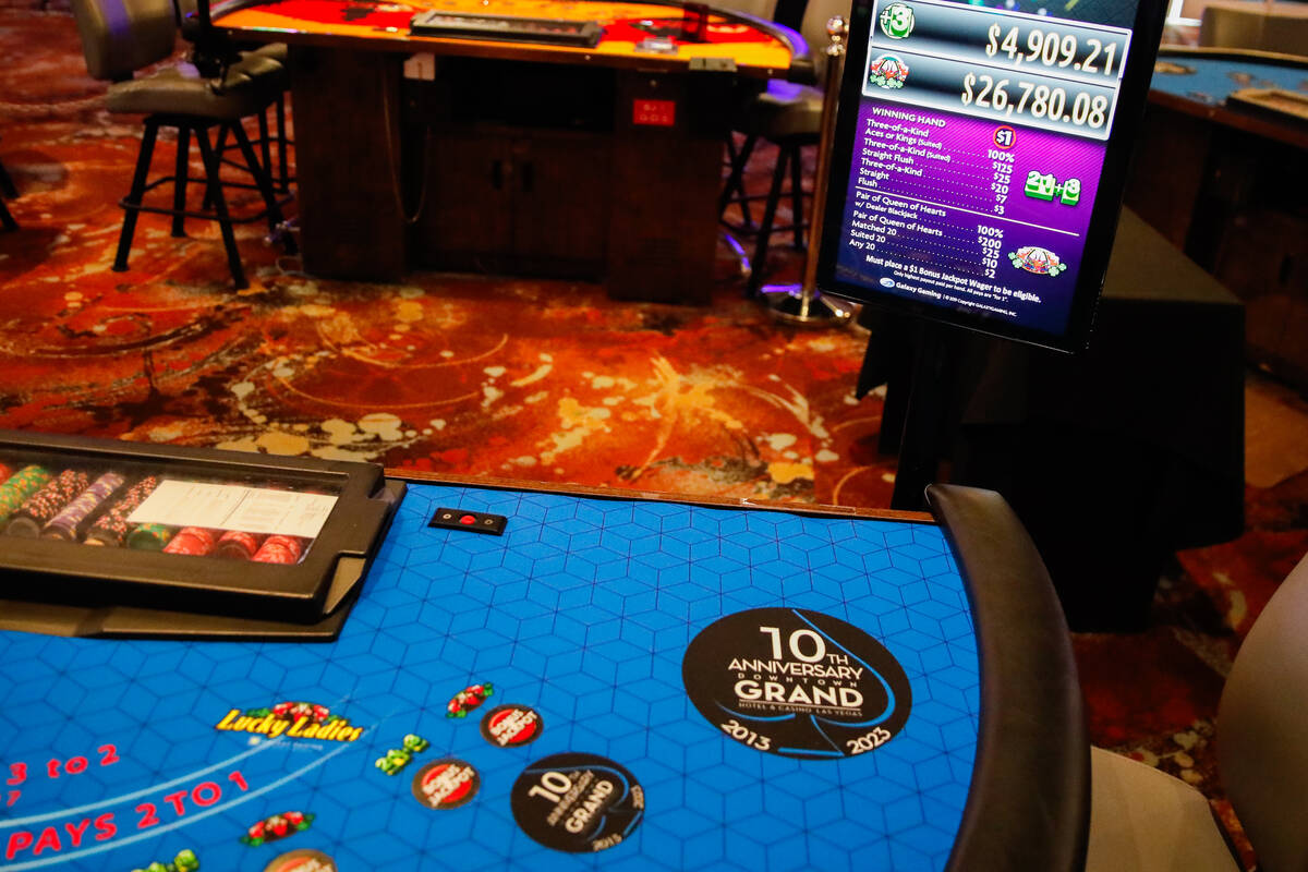 A table that displays a sticker in honor of the Downtown Grand Hotel and Casino’s 10th a ...