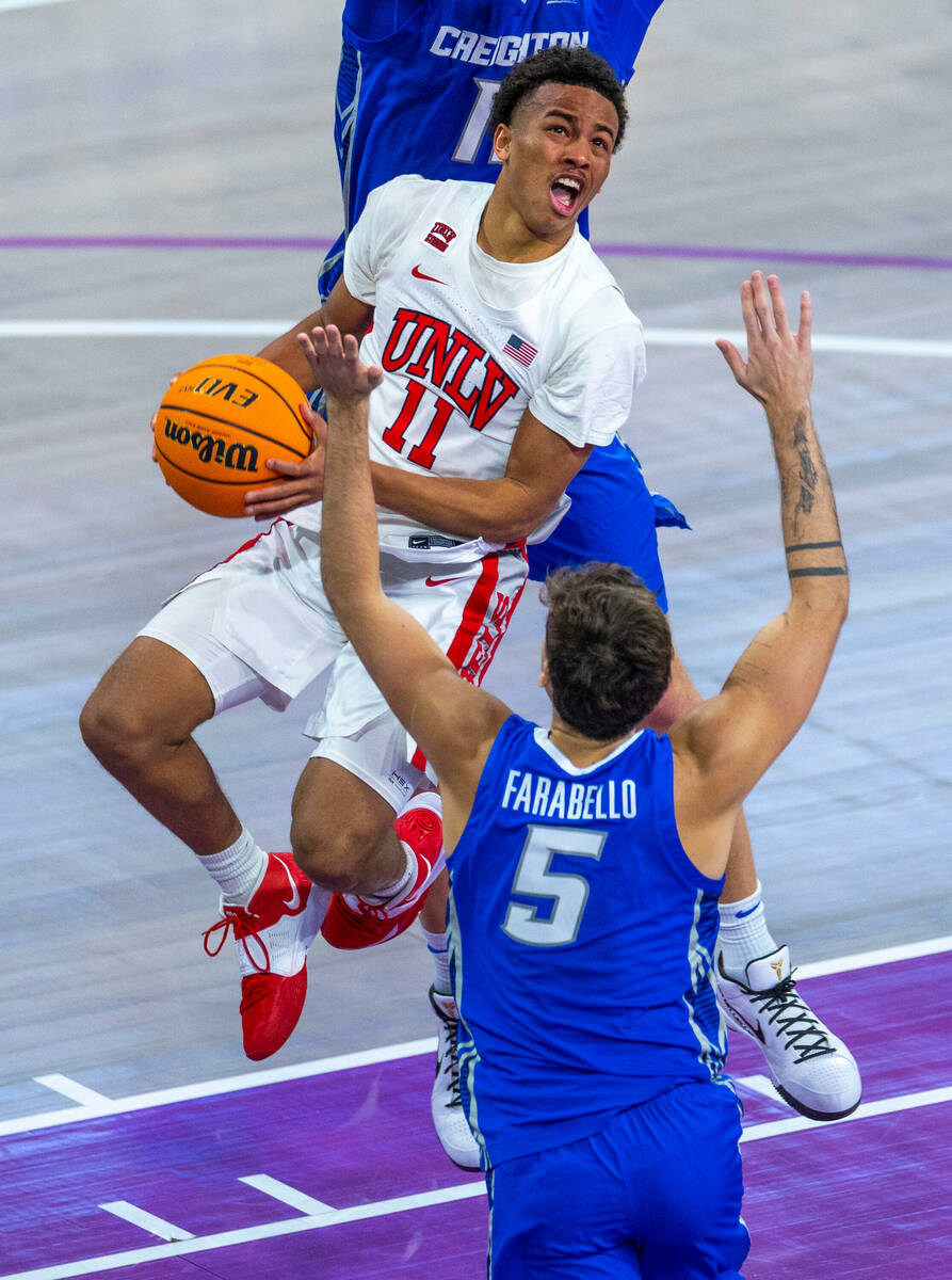 UNLV Rebels guard Dedan Thomas Jr. (11) looks to shoot as he sails to the basket against Creigh ...