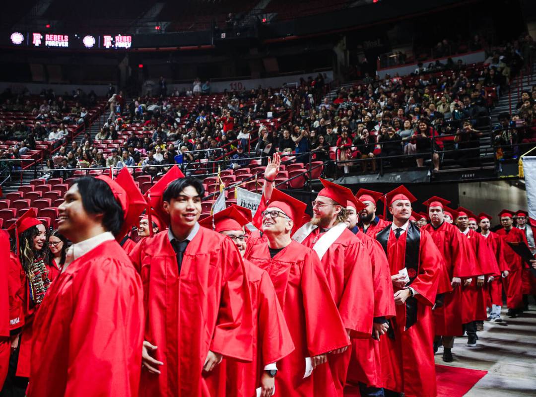 UNLV graduates wave to family and friends at the winter commencement ceremony at the Thomas &am ...