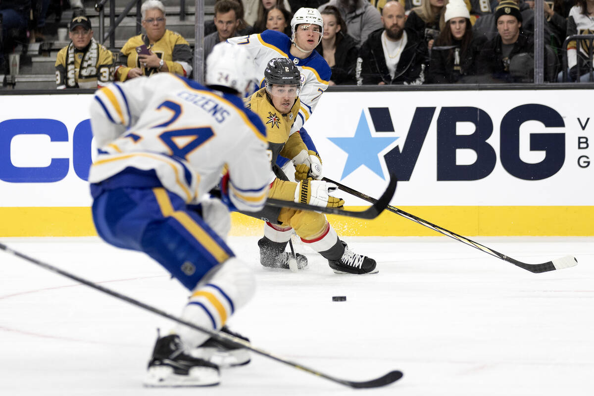 Golden Knights defenseman Zach Whitecloud (2) interrupts a pass between Sabres right wing JJ Pe ...