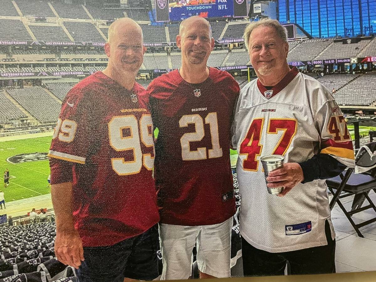 Damion Fleming (left), Shawn Fleming (middle) and Allan Fleming (right) at a football game. (Mo ...