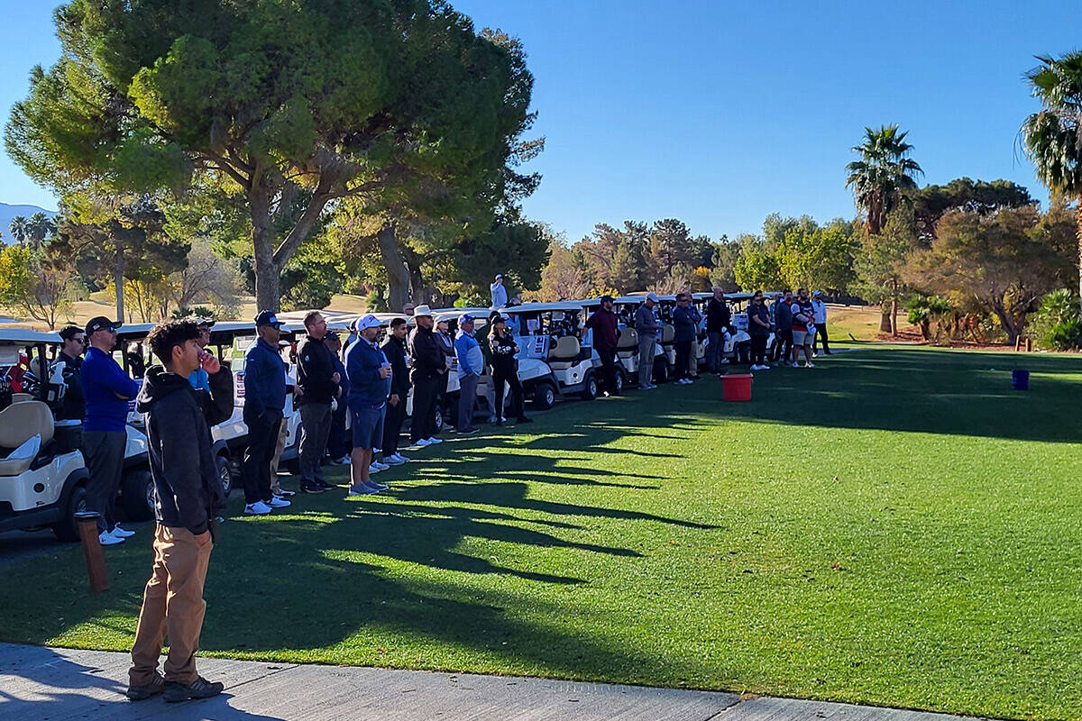 Golfers looking up at the balcony before the Swing For Their Kids tournament. (Mark Credico/Las ...