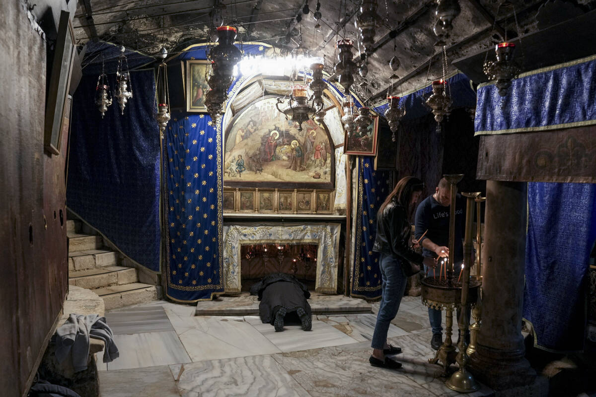 People visit the Grotto, under the Church of the Nativity, traditionally believed to be the bir ...