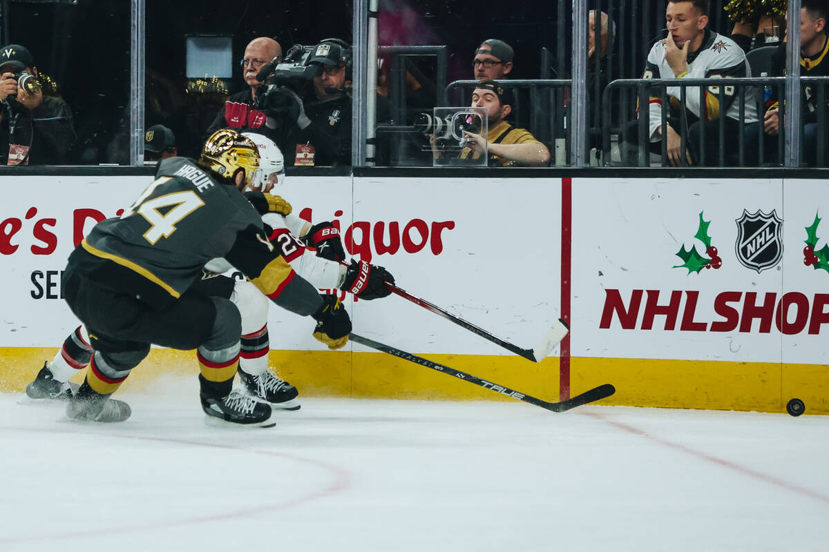 Golden Knights defenseman Nicolas Hague (14) and Ottawa Senators right wing Claude Giroux (28) ...