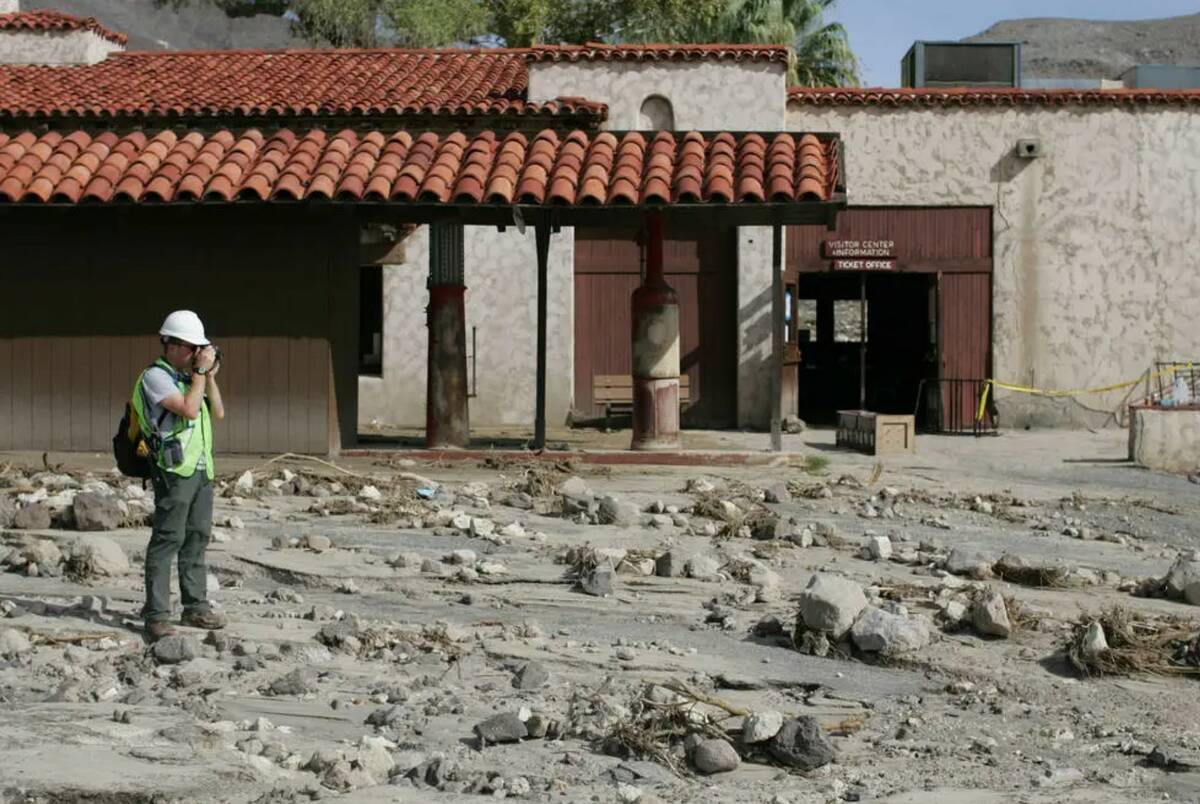 Assistant Dan Kish takes photos and video of the flooding damage done to Scotty's Castle in Dea ...