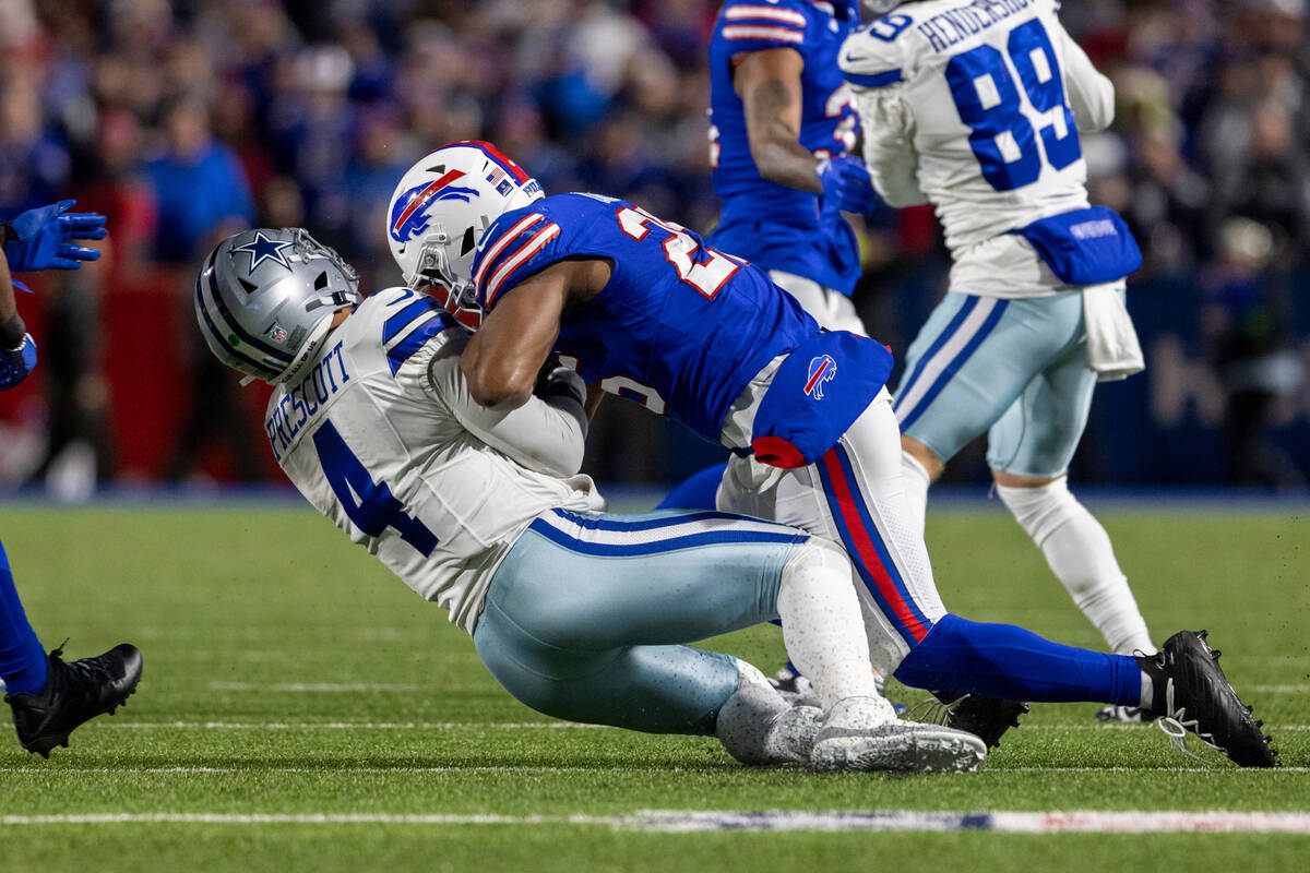 Buffalo Bills linebacker Tyrel Dodson (25) hits Dallas Cowboys quarterback Dak Prescott (4) dur ...