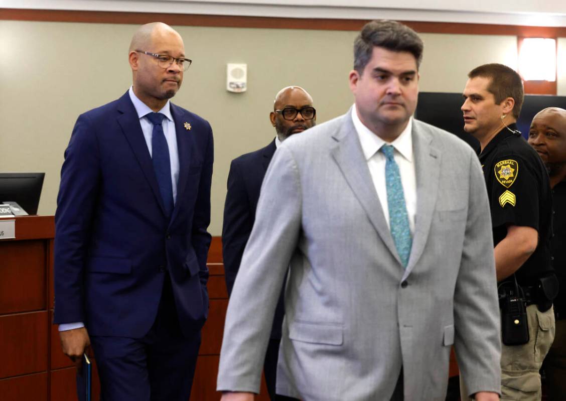 Nevada's Attorney General Aaron Ford, left, and Matthew Rashbrook, a special prosecutor, enter ...