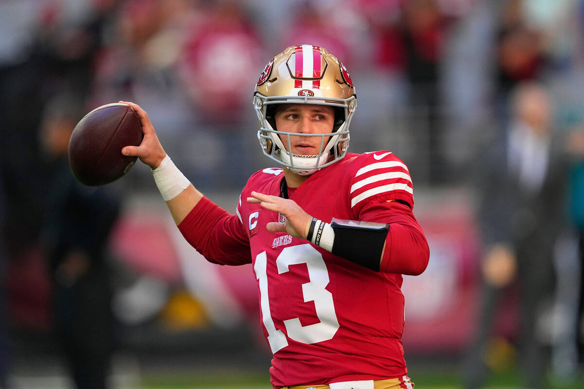 San Francisco 49ers quarterback Brock Purdy warms up before an NFL football game against the Ar ...