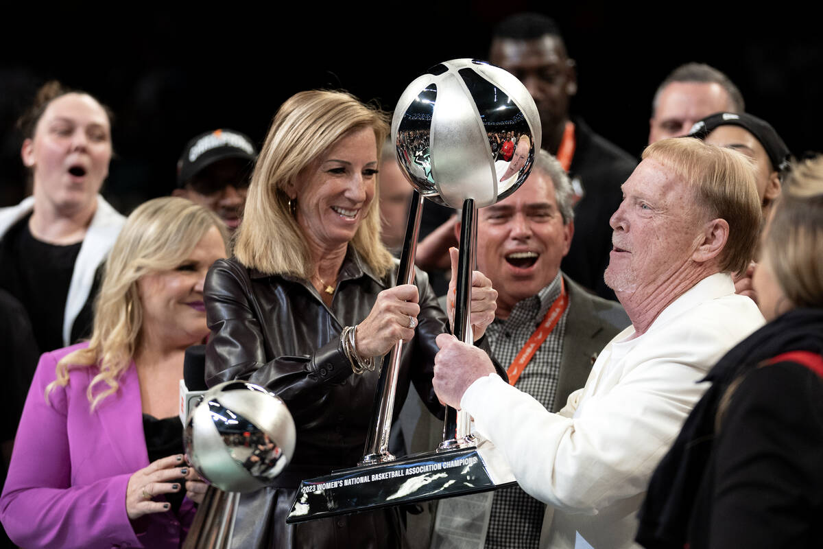 WNBA Commissioner Cathy Engelbert presents Las Vegas Aces owner Mark Davis with his team&#x2019 ...