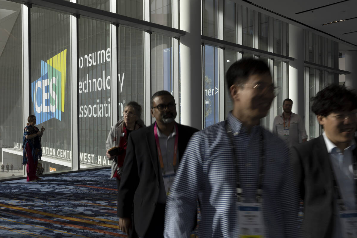 Attendees travel between halls during the CES tech show at the Las Vegas Convention Center on S ...