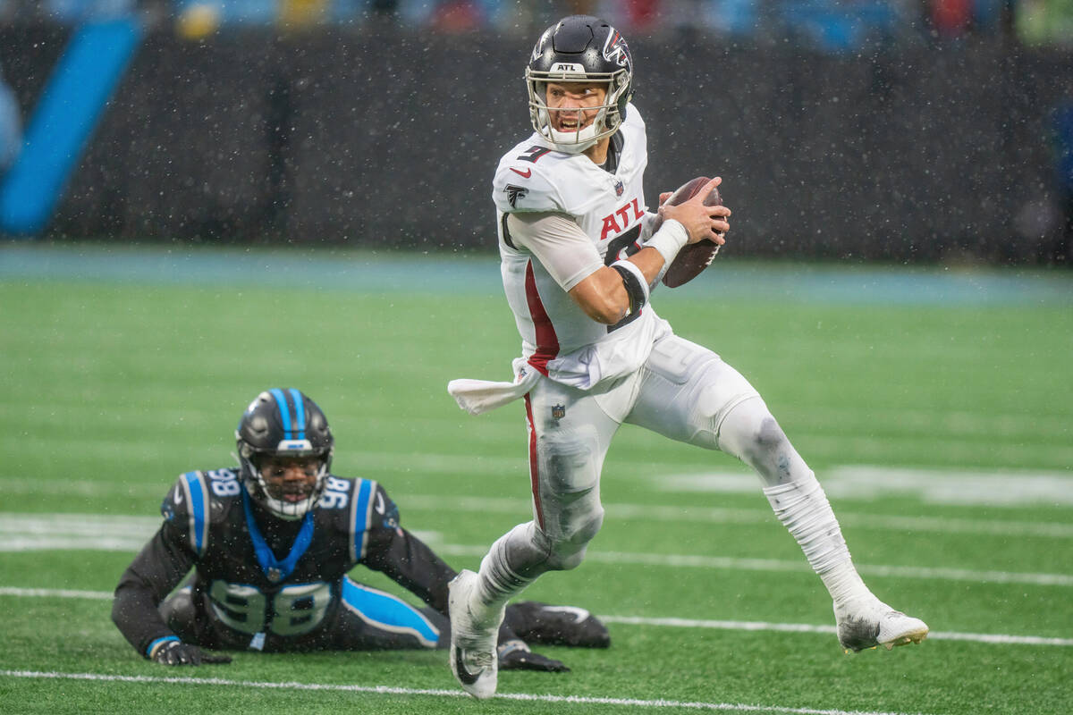 Carolina Panthers linebacker Marquis Haynes Sr. (98) pursues Atlanta Falcons quarterback Desmon ...