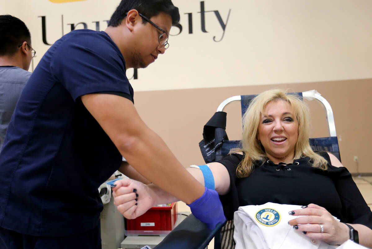 FILE - Syndicated radio personality and family physician Dr. Daliah Wachs donates blood with Un ...