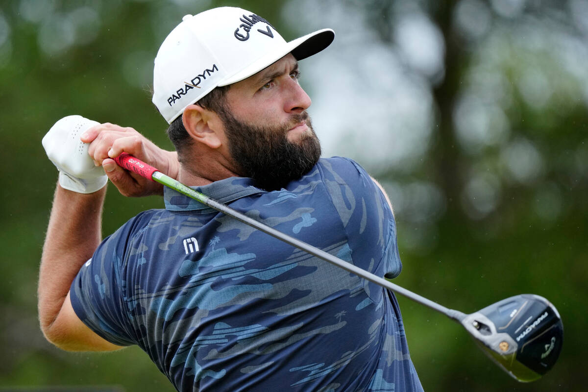 Spain's Jon Rahm plays his tee shot on the 18th hole during the third day of the British Open G ...