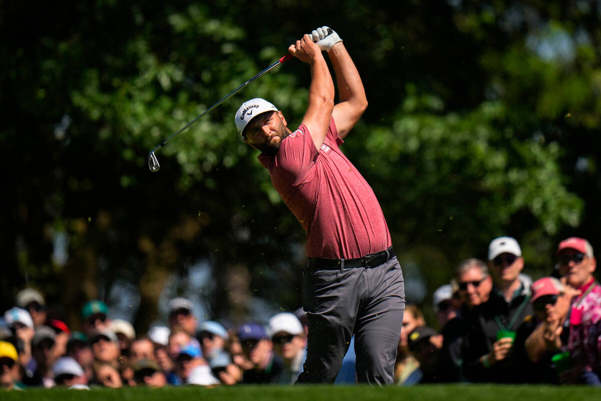 Jon Rahm, of Spain, watches his tee shot on the fourth hole during the final round of the Maste ...