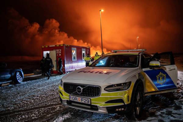 The police vehicle is parked at the entrance of the road to Grindavík with the eruption in ...
