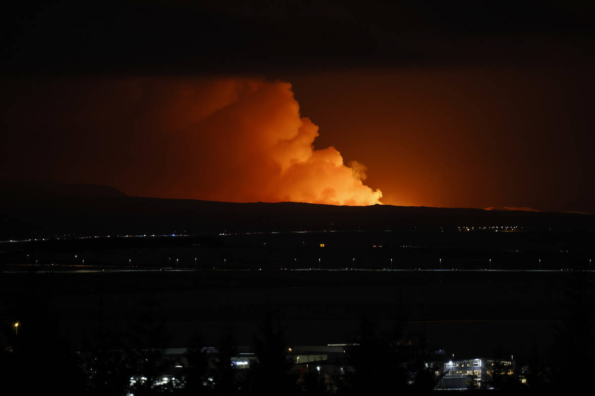 The night sky is illuminated caused by the eruption of a volcano on the Reykjanes peninsula of ...
