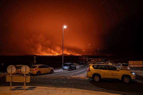 The road is blocked at the entrance of the road to Grindavík with the eruption in the back ...