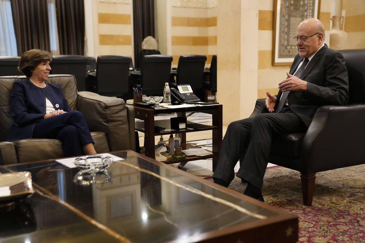 French Foreign Minister Catherine Colonna, left, meets with Lebanese caretaker Prime Minister N ...