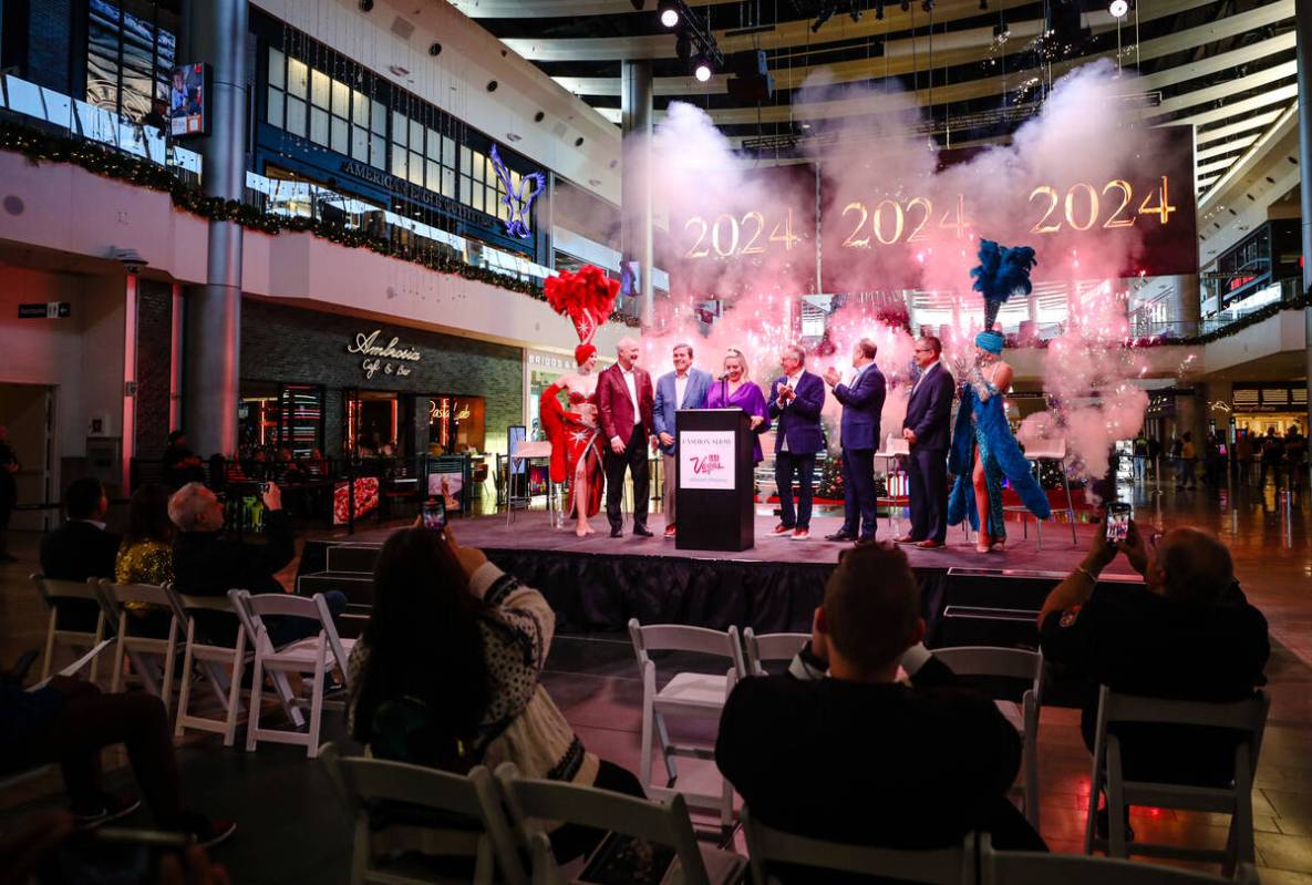 Officials applaud at a news conference announcing the New Year’s Eve fireworks plan at F ...