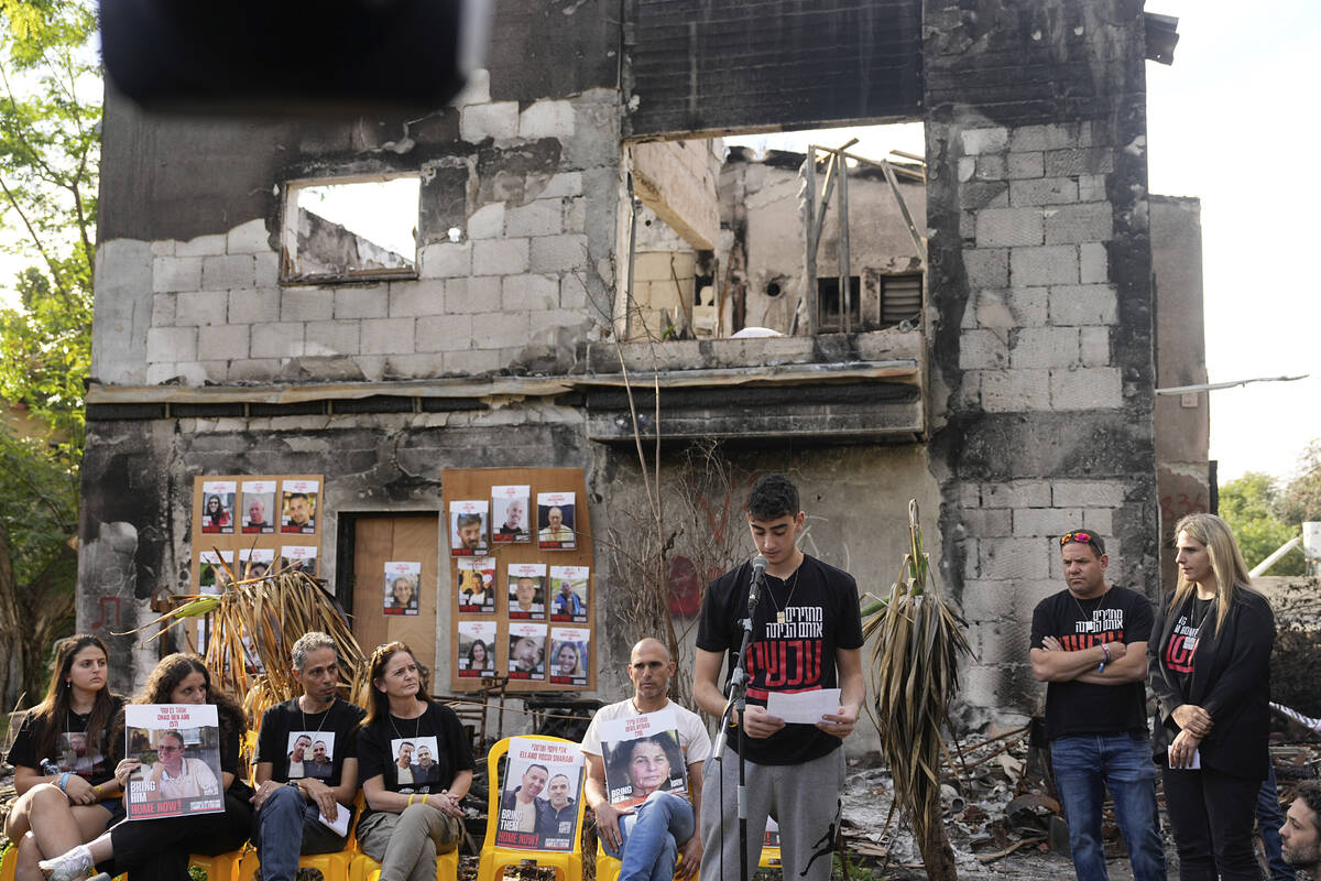 Former Israeli hostage Ofir Engel, 18, center, who was released from Hamas captivity, speaks to ...