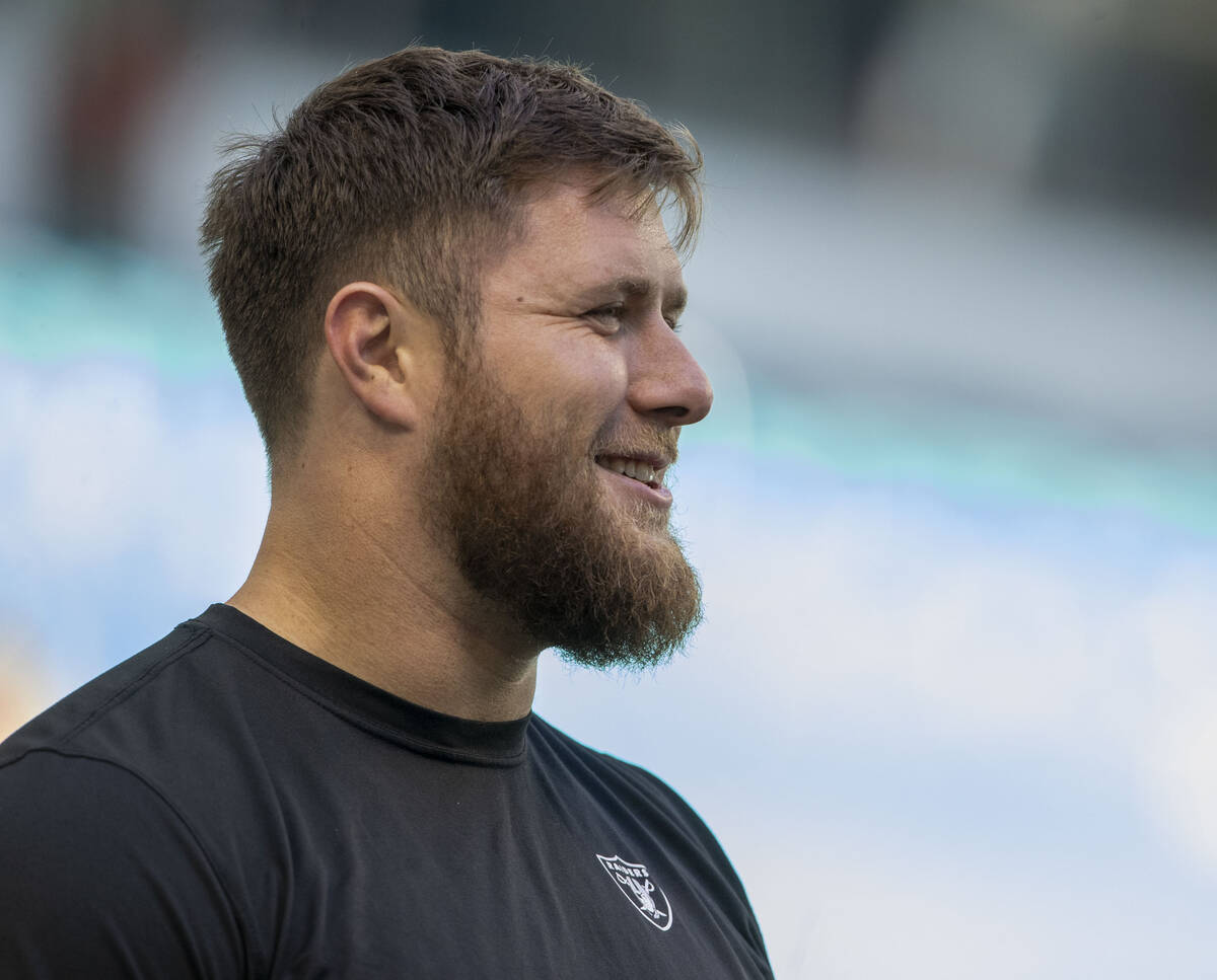 Raiders offensive tackle Kolton Miller on the field before an NFL game against the Miami Dolphi ...