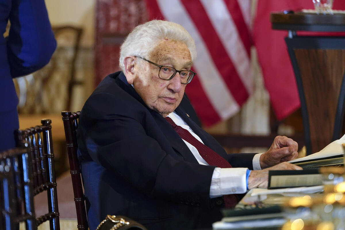 Former U.S. Secretary of State Henry Kissinger attends a luncheon with French President Emmanue ...