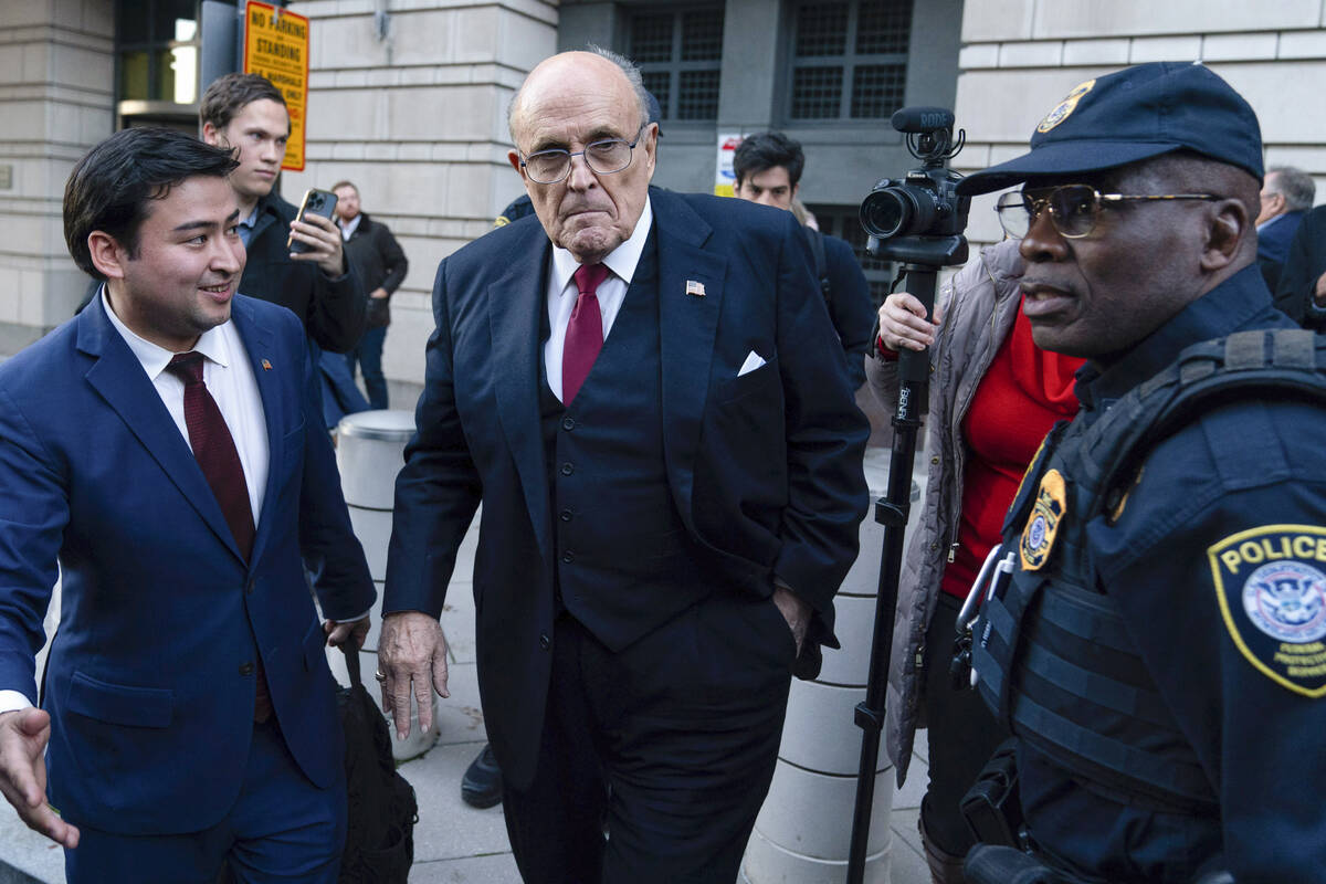 FILE - Former Mayor of New York Rudy Giuliani leaves the federal courthouse in Washington, Frid ...