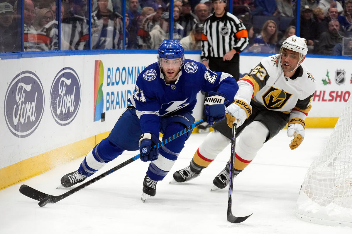 Tampa Bay Lightning center Brayden Point (21) skates ahead of Vegas Golden Knights defenseman A ...