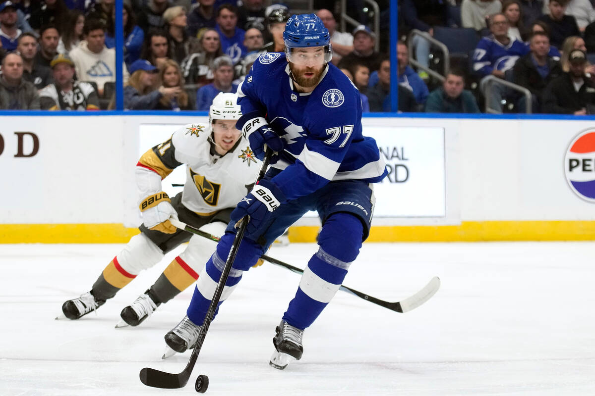 Tampa Bay Lightning defenseman Victor Hedman (77) carries the puck ahead of Vegas Golden Knight ...