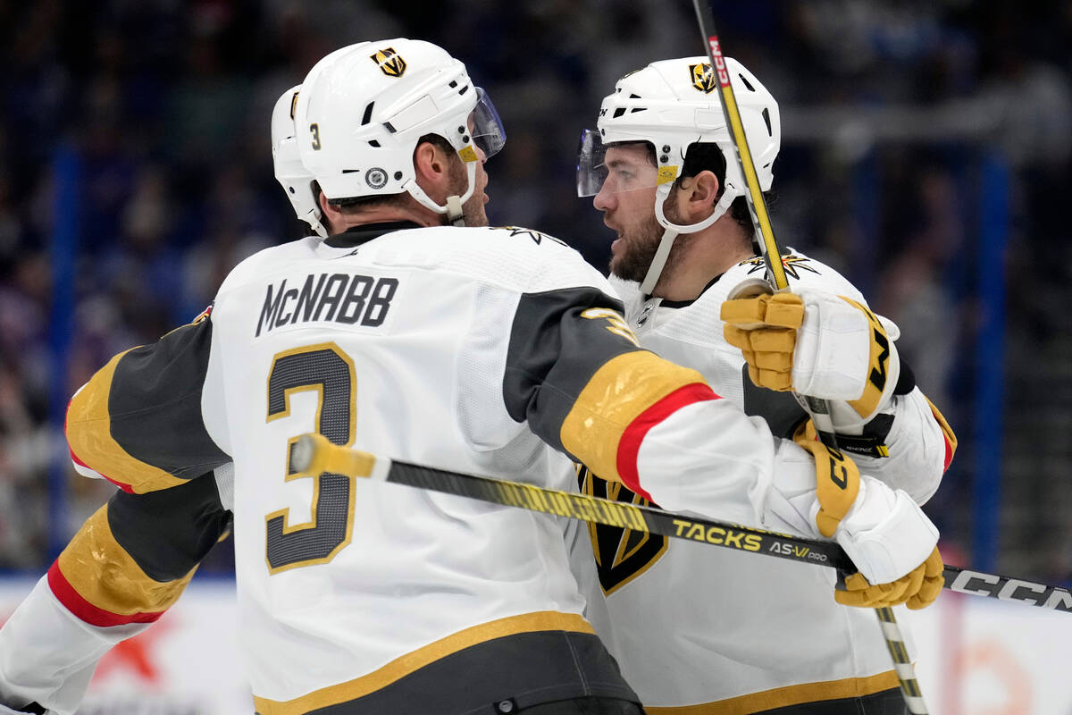 Vegas Golden Knights center Paul Cotter, right, celebrates with defenseman Brayden McNabb after ...