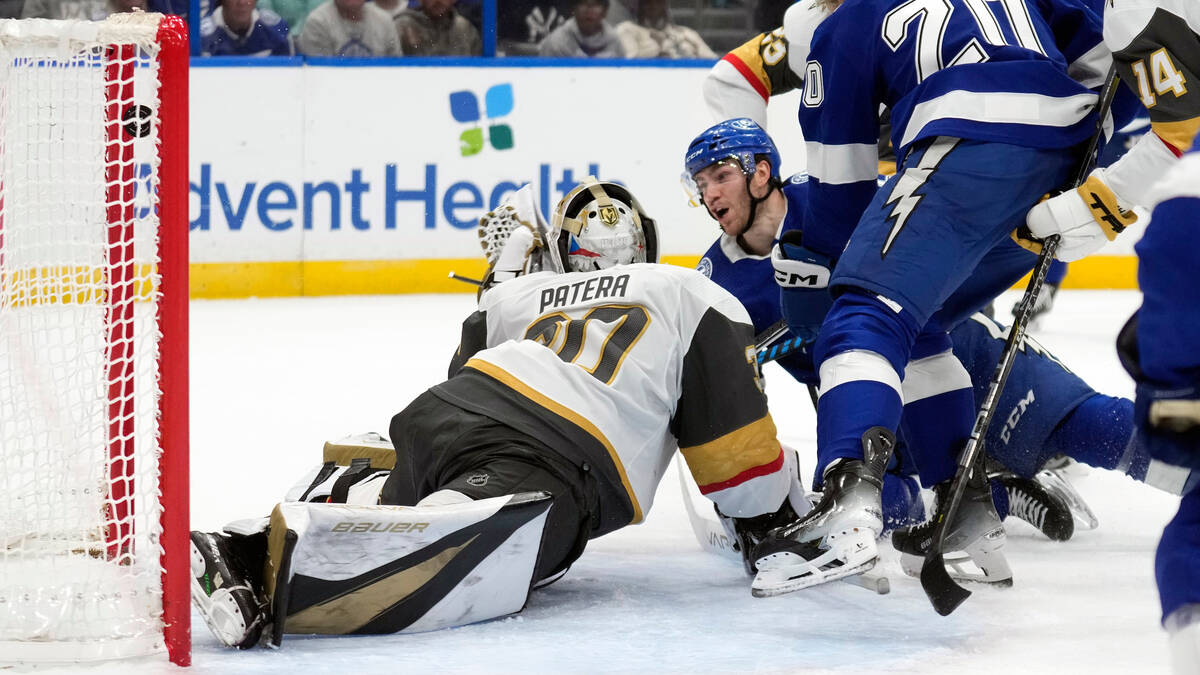 Tampa Bay Lightning center Brayden Point, lower right, watches his shot get past Vegas Golden K ...