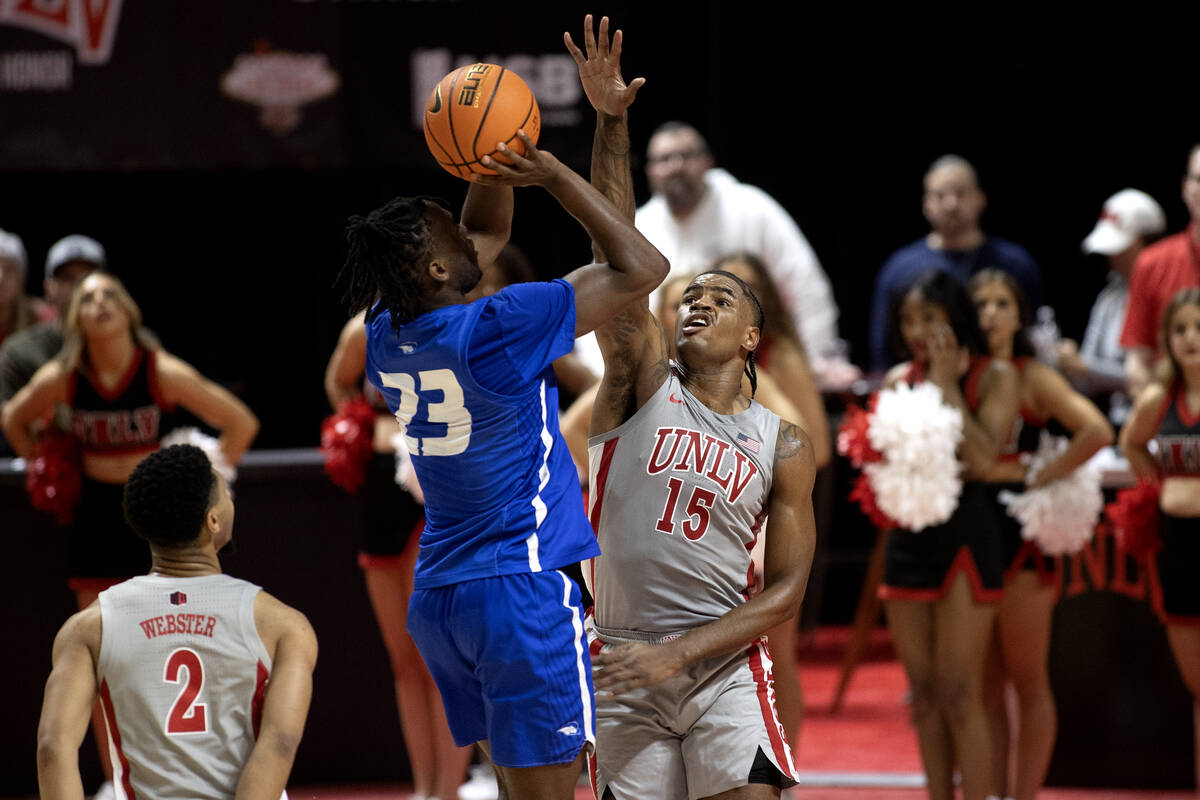 UNLV Rebels guard Luis Rodriguez (15) jumps to block against Hofstra Pride guard Tyler Thomas ( ...