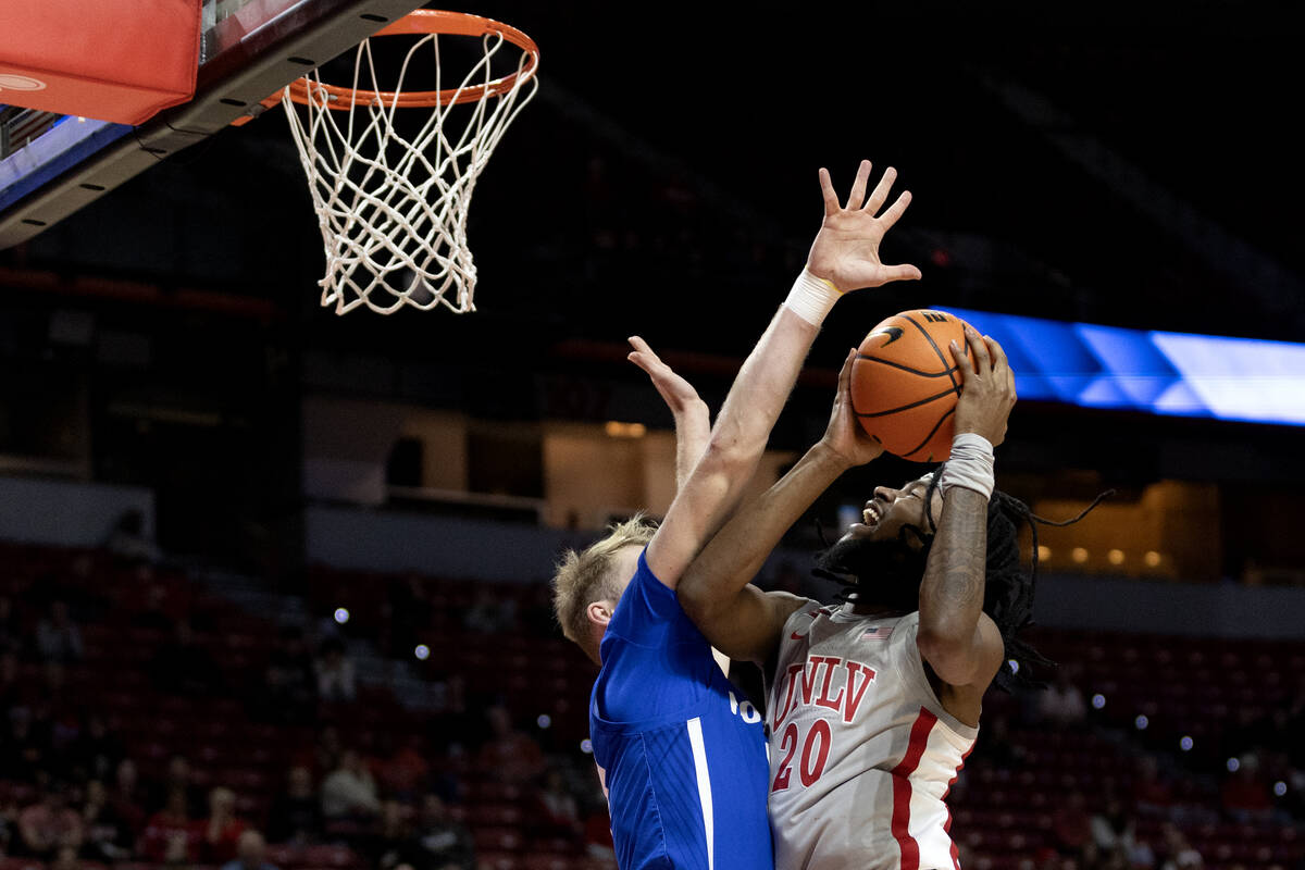 UNLV Rebels forward Keylan Boone (20) shoots against Hofstra Pride forward Jacco Fritz (11) dur ...