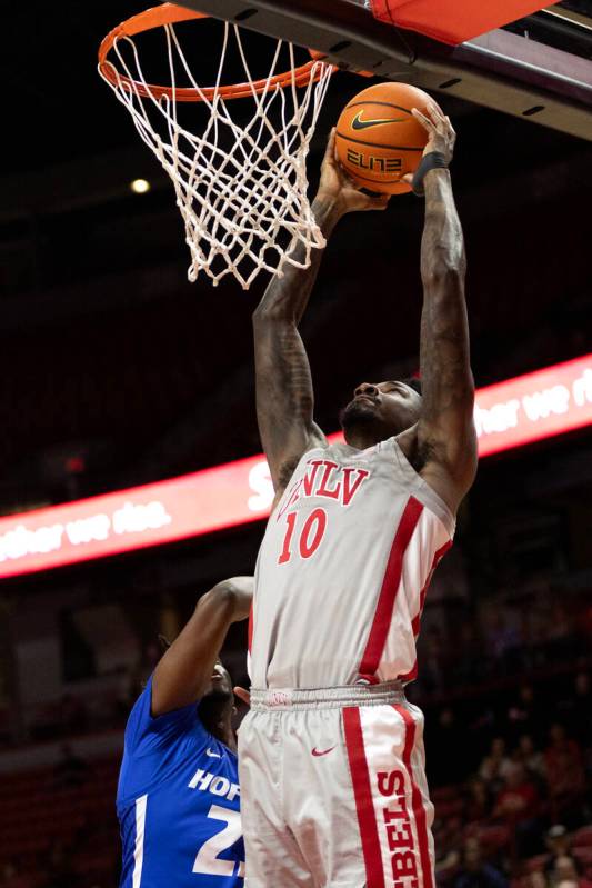 UNLV Rebels forward Kalib Boone (10) dunks against Hofstra Pride guard Tyler Thomas (23) during ...