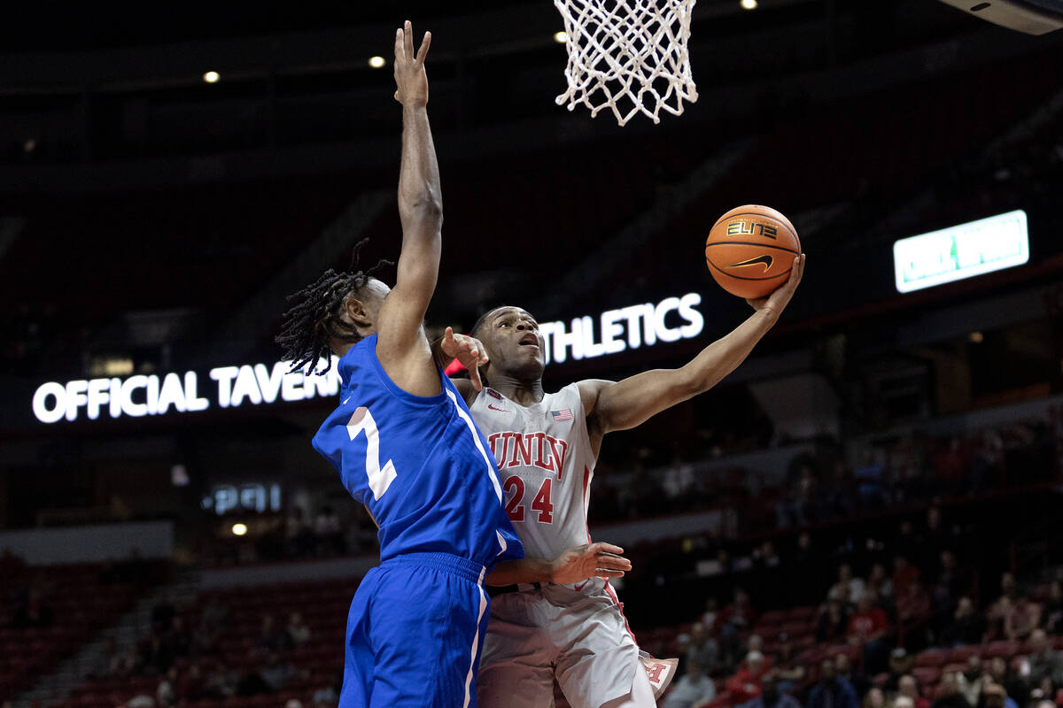 UNLV Rebels guard Jackie Johnson III (24) shoots against Hofstra Pride guard Bryce Washington ( ...