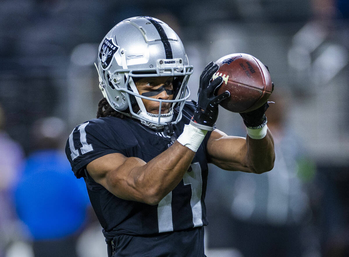 Raiders wide receiver Tre Tucker (11) catches a pass during warmups before the first half of th ...